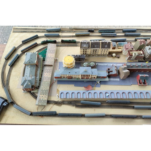 311A - An N Guage layout on large board including buildings, carriages, locos etc all unboxed