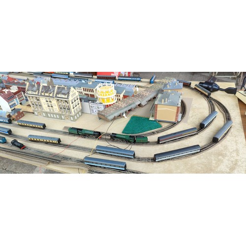 311A - An N Guage layout on large board including buildings, carriages, locos etc all unboxed