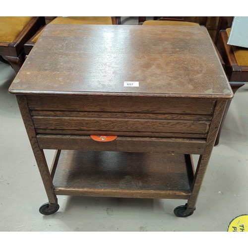 657 - A 1930's oak sewing box/trolley with hinged lid and drawer; a mahogany fire screen and occasional ta... 