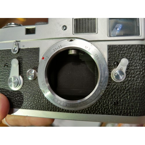 117 - A LEICA M2 chrome 35mm camera c.1960, serial no 966842, with 35mm f2 Summicron lens, leather E.R. ca... 