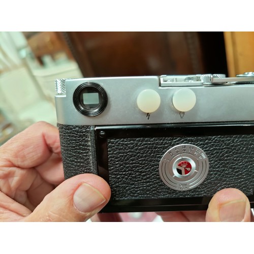 117 - A LEICA M2 chrome 35mm camera c.1960, serial no 966842, with 35mm f2 Summicron lens, leather E.R. ca... 