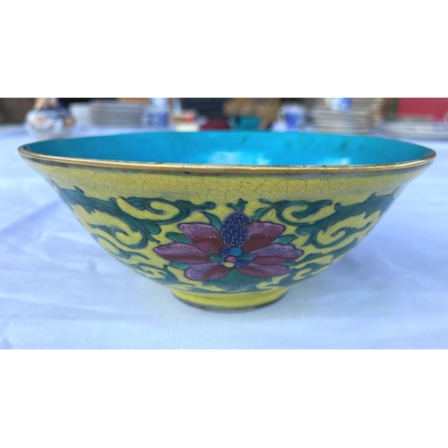 383 - A Chinese yellow glaze bowl with detailed leaves connecting three red flowers, with turquoise glaze ... 
