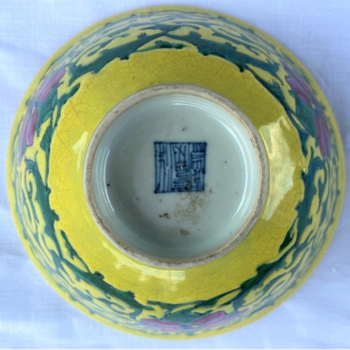 383 - A Chinese yellow glaze bowl with detailed leaves connecting three red flowers, with turquoise glaze ... 