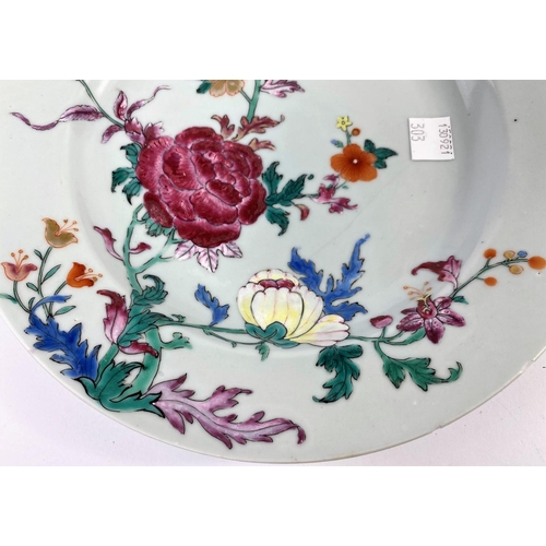 303 - A pair of 18th century Chinese plates with polychrome decoration of flowers, diameter 23cm (minor fr... 