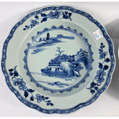 308A - A pair of 18th century Chinese blue and white shallow dishes with traditional mountain scenes, scall... 