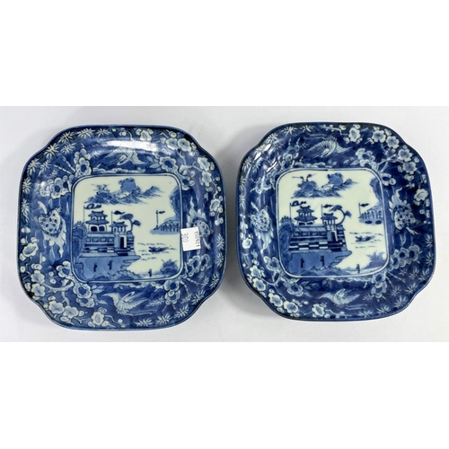 309 - 2 Japanese blue and white squared dishes with central mountain scene and borders with mythical anima... 