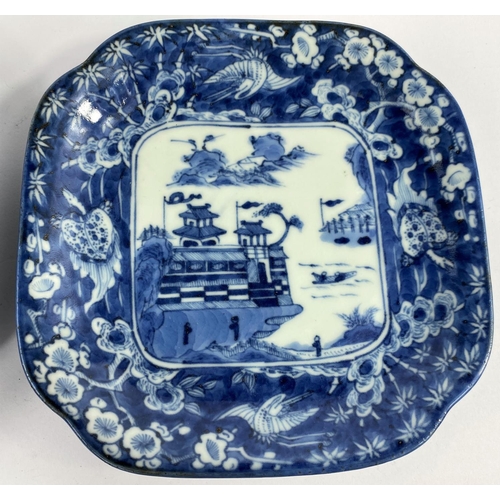 309 - 2 Japanese blue and white squared dishes with central mountain scene and borders with mythical anima... 