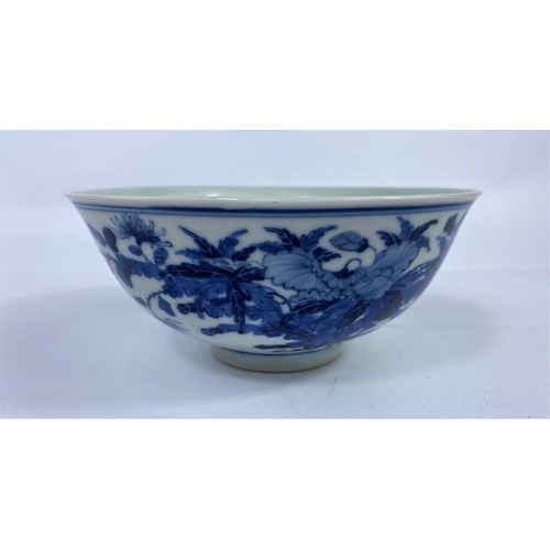 309A - A Chinese blue and white bowl with detailed leaves and floral decoration to exterior, 6 character ma... 