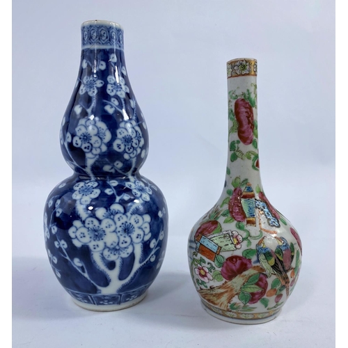 312 - A 19th century Chinese blue and white double gourd vase, prunus blossom decoration, h. 19cm (rim a.f... 