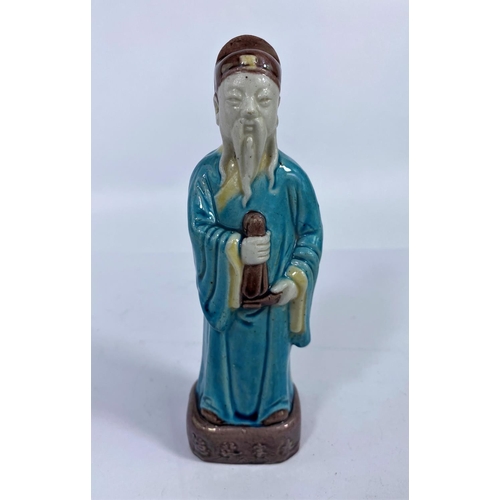 314 - A Chinese ceramic figure of a scholar in blue robes, h. 19cm (Good condition)