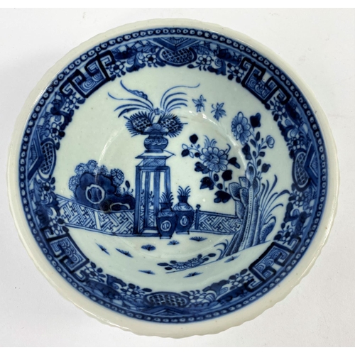 314A - An 18th century Chinese blue and white porcelain bowl with pie crust rim decorated with antiques and... 