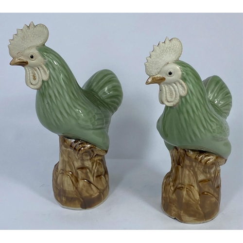 319 - A pair of Chinese cockerels, ht. 24cm (Both in good condition)
