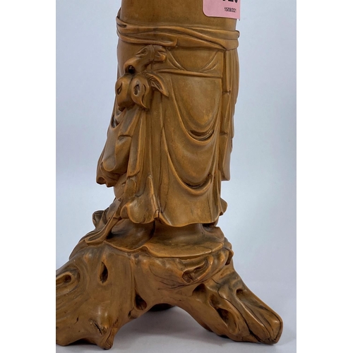 320 - A Chinese carved wood figure of a sage, ht. 24cm (Finely carved rootwood, some cracks notably to fac... 