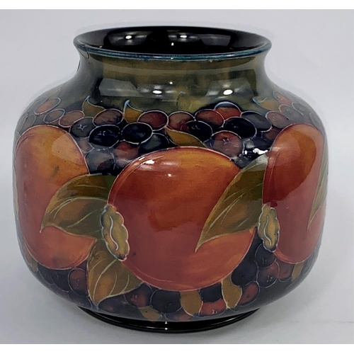 401a - An early Moorcroft Pottery Vase of globular form, pomegranite pattern, 15.5cm (small chip to rim)
