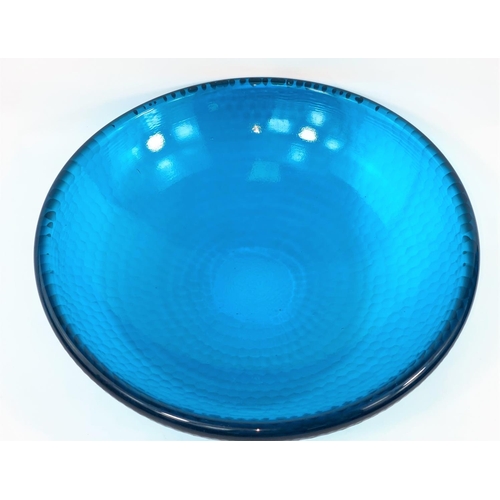 402 - A turquoise art glass bowl with smooth interior and honeycomb faceted exterior, diameter 35cm