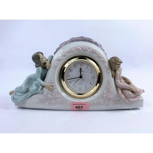403 - A Lladro porcelain clock, numbered 5776, with quartz movement & two young girls sat either side, len... 