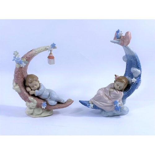 403A - Two Lladro porcelain groups - babies sleeping on crescent moons, 1 boy & 1 girl.  No/6583, 6479, hei... 