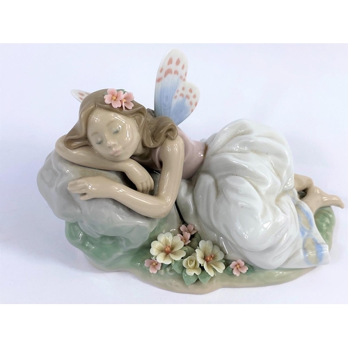 403C - A Lladro privilege figure, girl with butterfly wings     
No/ 7694, width 16cm.