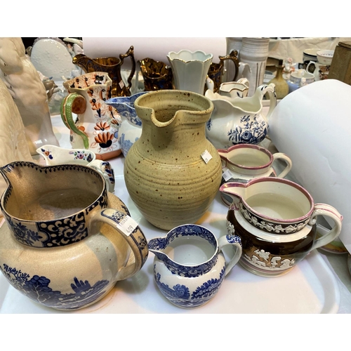 409 - A selection of Victorian and later jugs, including a Sunderland lustre jug 'The Gamonon in a strorm'... 