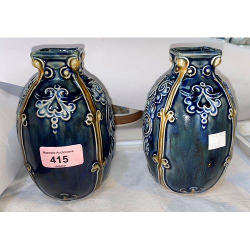 415 - A Royal Doulton pair of Lambeth stoneware vases, 15 cm; a silica vase; a cut glass vase with silver ... 