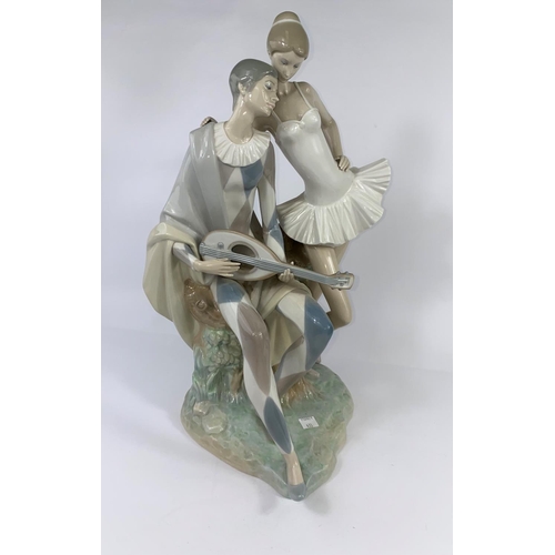 433 - A large Lladro group:  harlequin with mandolin and ballet dancer, height 47 cm