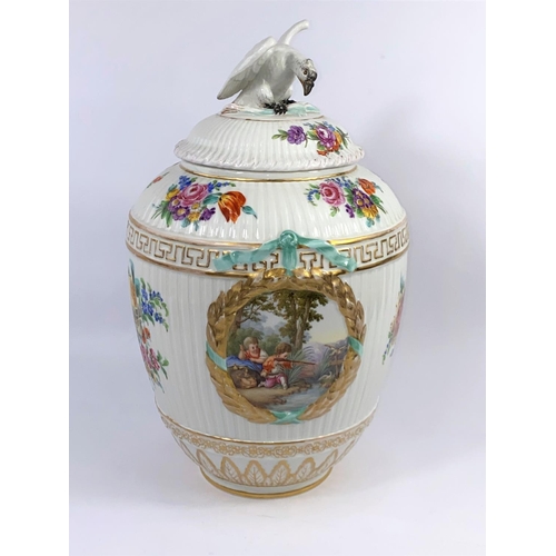 436 - A 19th century KPM Berlin covered porcelain vase with ribbed body, decorated with 2 wreathed panels ... 