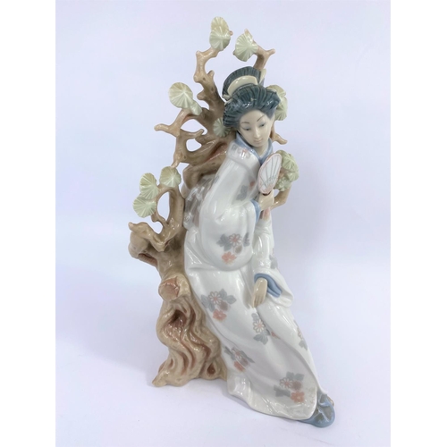 452 - A Lladro group:  Japanese lady by a tree, height 32 cm