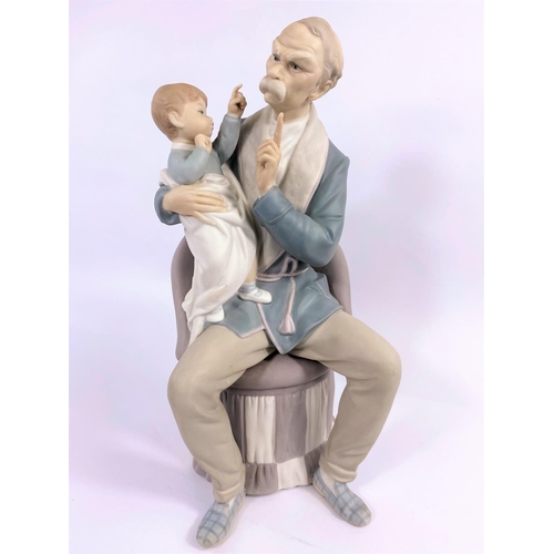 454 - A Lladro group:  grandfather and child, height 29 cm