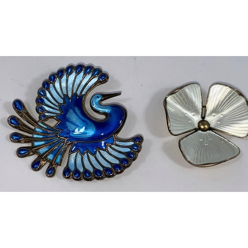475 - A Norwegian blue enamelled sterling brooch of a mythical bird by David Andersen; a similar floral br... 