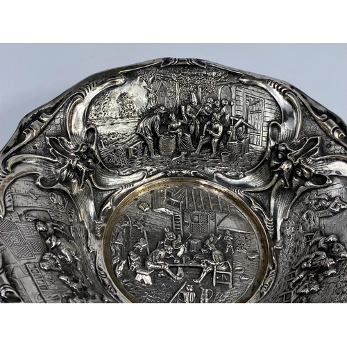479 - A 19th century Dutch silver bowl with high relief decoration of genre scenes, 14.5 oz