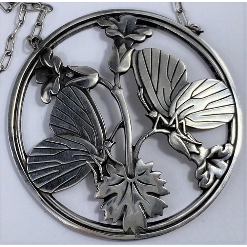 495 - A George Jensen silver pendant designed by Arno Malinowski:  2 butterflies perched on flowering bran... 