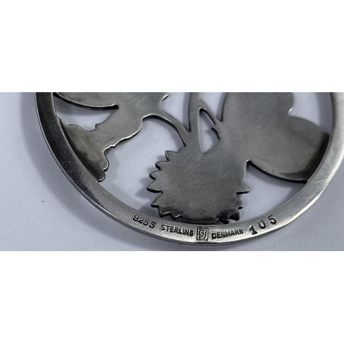 495 - A George Jensen silver pendant designed by Arno Malinowski:  2 butterflies perched on flowering bran... 