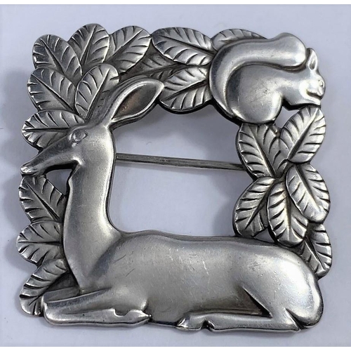 498 - A Georg Jensen square silver brooch designed by Arno Malinowski:  deer lying in foliage with squirre... 