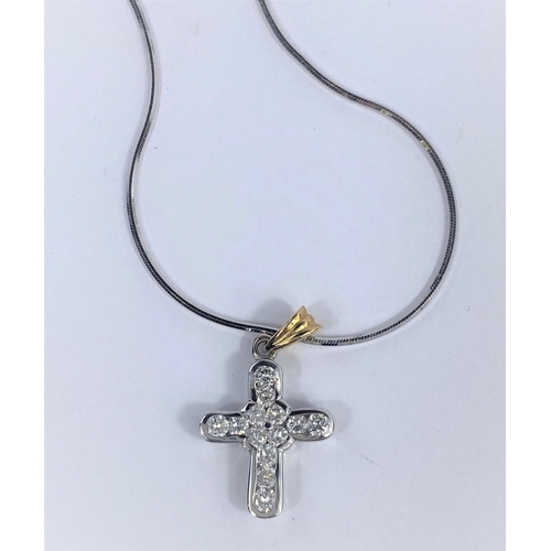 520 - An 18 carat hallmarked yellow and white gold cross pendant set 13 diamonds, 2 mm approx, on fine 18 ... 