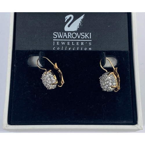 521 - A pair of Swarovski cluster gem set earrings, cased
