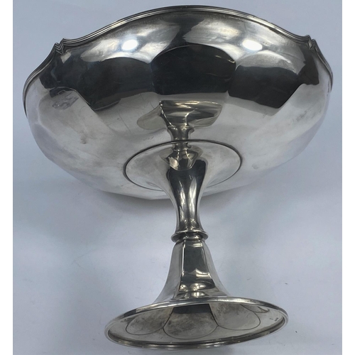 541 - A hallmarked silver circular ribbed dish on pedestal with flared foot, Birmingham 1918, bears name '... 