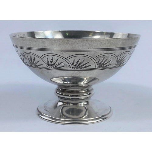 544 - A circular pedestal bowl with chased and engraved band, Sheffield 1930, diameter 12 cm, 8oz