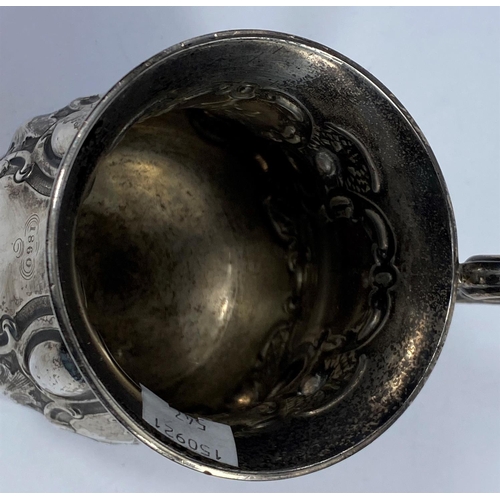 547 - A hallmarked silver Victorian half pint mug on scroll feet, ornate decoration, inscribed, London 185... 