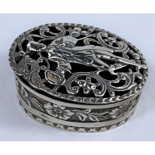 563 - A hallmarked silver oval trinket box ornately pierced and embossed, London 1897, length 7 cm