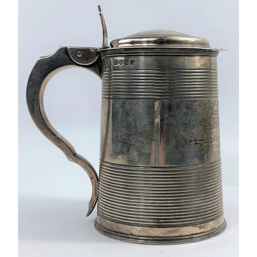 570 - A Georgian hallmarked silver 1 quart tankard of tapering cylindrical form with bands of ribbed decor... 