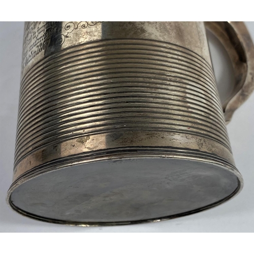 570 - A Georgian hallmarked silver 1 quart tankard of tapering cylindrical form with bands of ribbed decor... 