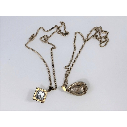 573 - A crystal set pendant on curb chain, stamped '375'; a similar teardrop pendant on chain, stamped '37... 