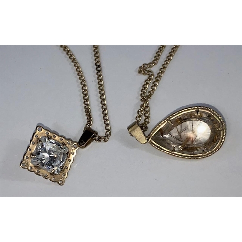 573 - A crystal set pendant on curb chain, stamped '375'; a similar teardrop pendant on chain, stamped '37... 