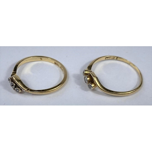 582 - Two yellow metal crossover rings, each set 3 diamonds, stamped '18ct', 3.9 gm