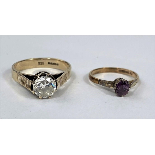 585 - A modern 9 carat hallmarked gold dress ring set with a large clear stone, 4.1 gm; a 9 carat hallmark... 