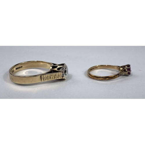 585 - A modern 9 carat hallmarked gold dress ring set with a large clear stone, 4.1 gm; a 9 carat hallmark... 