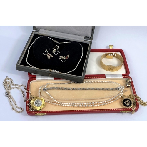 628 - A fine graduating seed pearl necklace, the white metal clasp set diamond chips and stamped '9 ct'; a... 