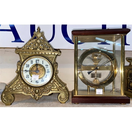 703 - An Edwardian mantel clock in ornate brass case; a desk top barometer a modern  'Hugo Metobar' barome... 