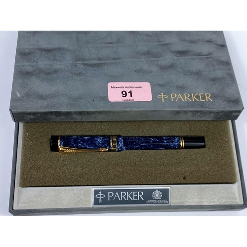 91 - A Parker 'The Duofold' fountain pen with yellow and white metal nib stamped 18ct, with blue marble e... 