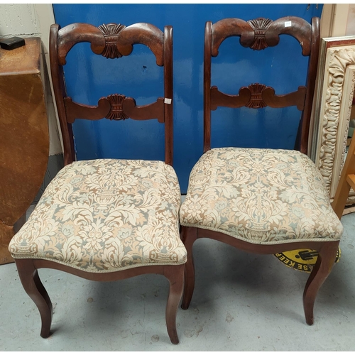 769 - A set of 19th century mahogany dining chairs with sabre legs, carved wheatsheaf back with floral sea... 